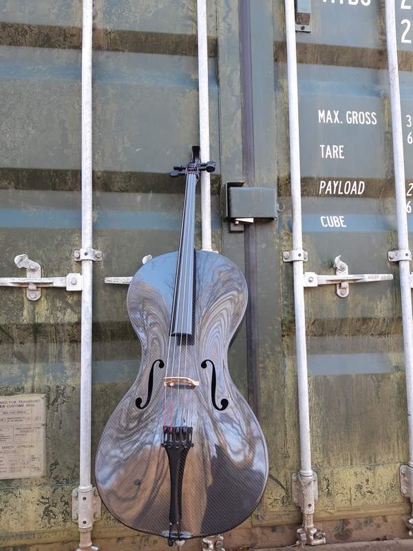 The HIghway Cello and a shipping container